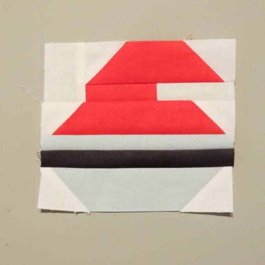 curling rock block pieced quilt block