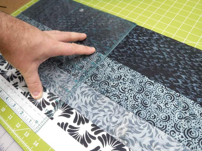 The Banyan Batiks Banyan Classics Collection Rail Fence quilt comes to life as the strip sets are cut into 12½" square blocks. Free pattern