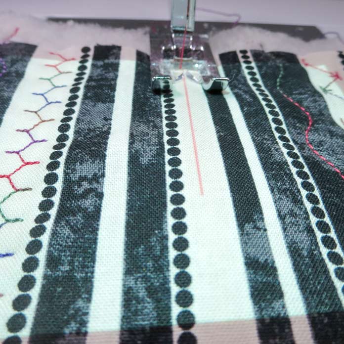 Use the projected guide line to keep your stitching lines straight.