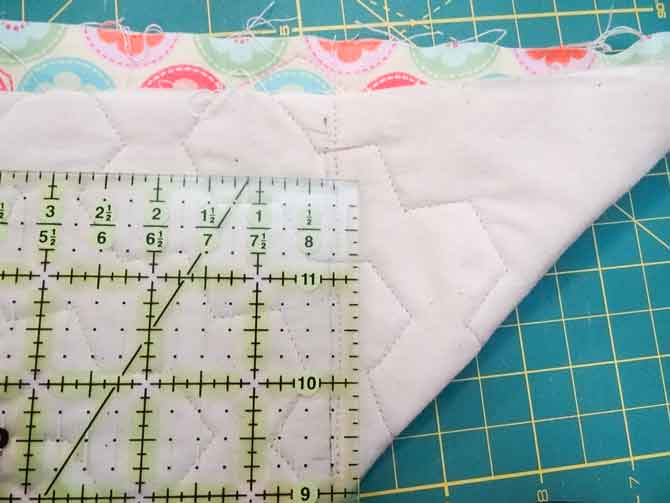 Cut excess fabric at ¼ʺ from line