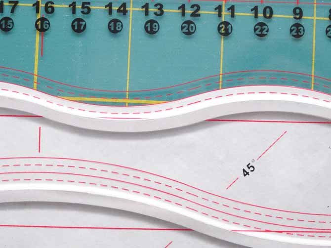 The Komfort KUT Slash-N-Circle Ruler is used to make a second cut that parallels the first line.