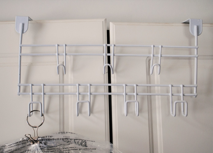Dollar store over-the-door wire rack helps to keep the quilting and sewing room organized.