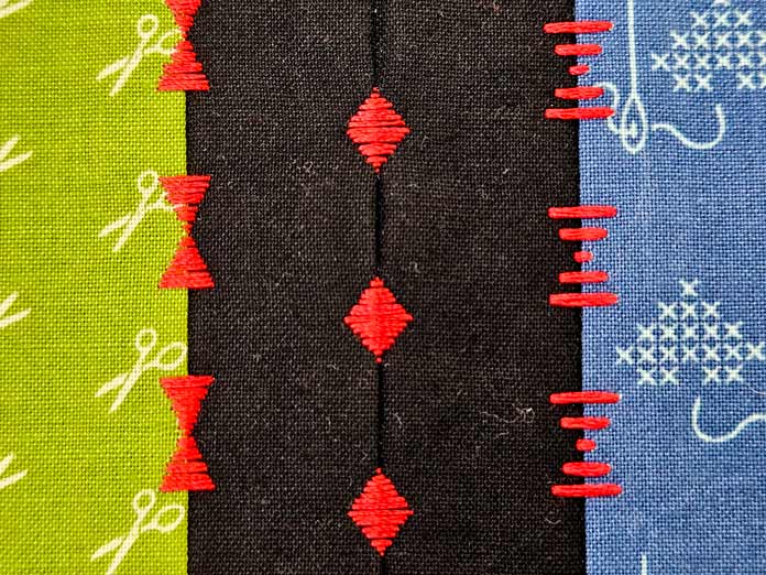 Red stitches on green, black, and blue fabrics