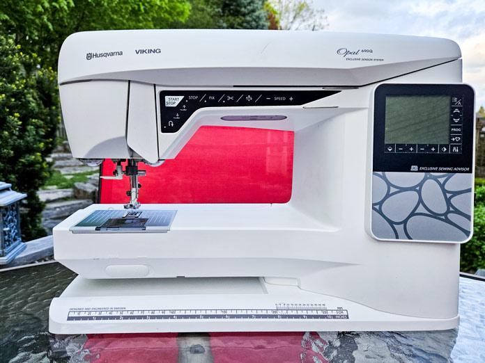 A white and grey sewing machine; Husqvarna VIKING Opal 690Q 