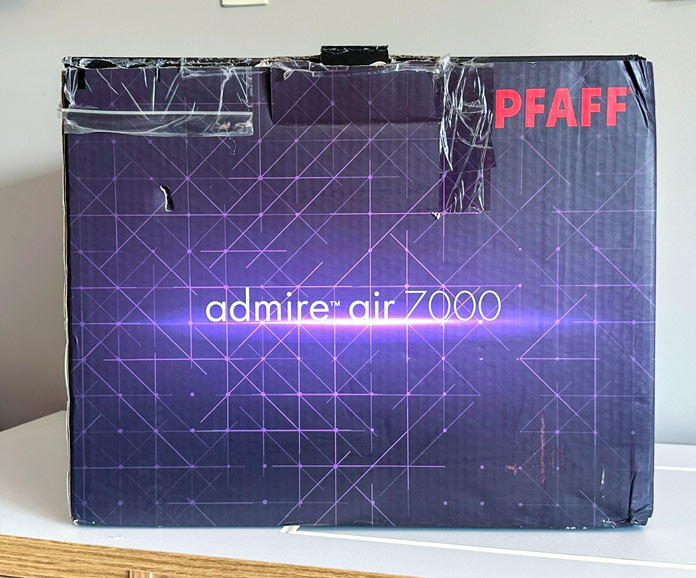 A purple and black box with admire air 7000 written on it; PFAFF admire air 7000