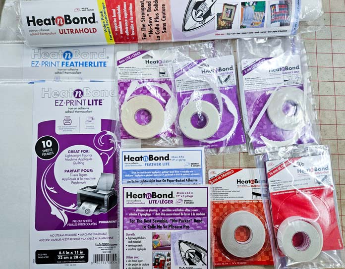 Packages of HeatnBond Featherlite, Lite, and Ultra adhesive tapes for fabric projects; HeatnBond, adhesive tapes, fusible web, fabric crafts