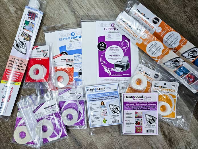 A variety of packages of fusible web products; HeatnBond, fusible web, sewing, applique, quilting, hemming, fabric adhesives, SoftStretch, Lite, Featherlite, Ultra, sewing tips, crafting, fabric experiments