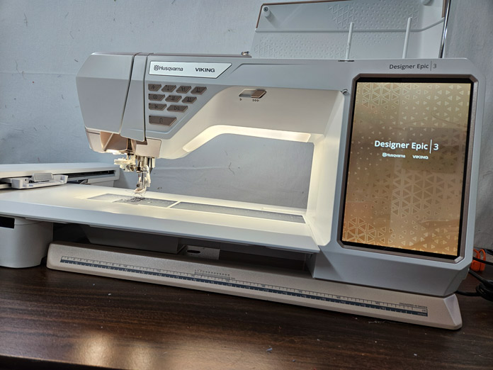 A white sewing machine; quilting, embroidery machine, machine embroidery, quilting techniques, Husqvarna VIKING, quilt labels, embroidery software, quilt embellishments, quilting tools, QUILTsocial, Husqvarna VIKING Designer Epic 3, Designer Epic 3