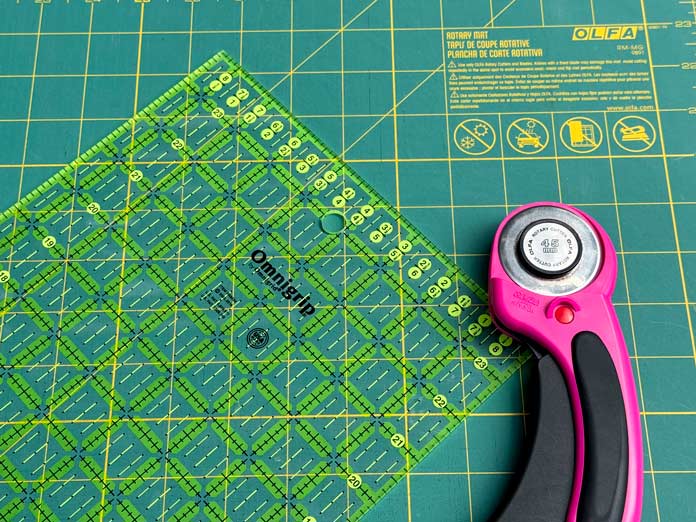 Omnigrip ruler with an OLFA rotary cutter on an OLFA mat