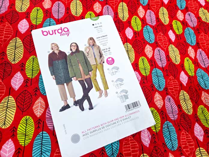 A paper pattern with three women on it