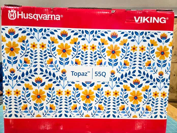 A red and white box with blue and yellow flowers