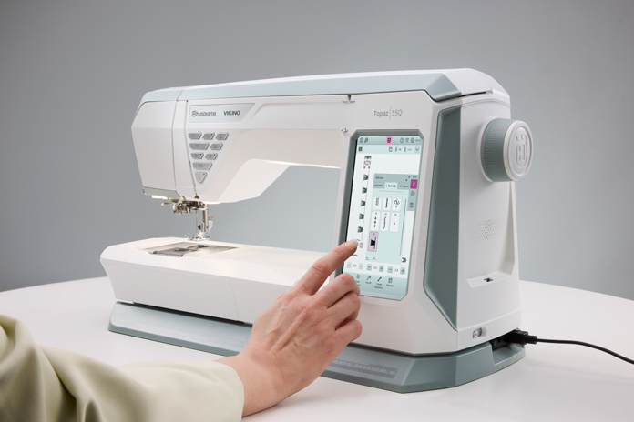 A white sewing machine screen
