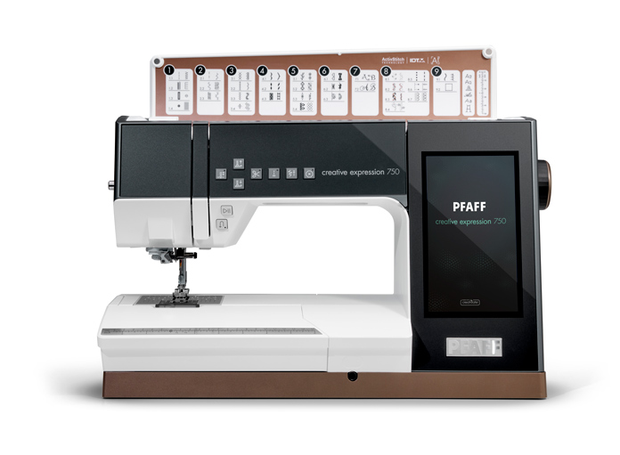 A picture of a deep charcoal and white sewing /embroidery machine with a large computer screen, turned on, waiting to be used.