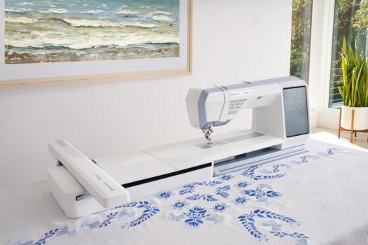 A blue and white embroidery machine on a blue and white cloth