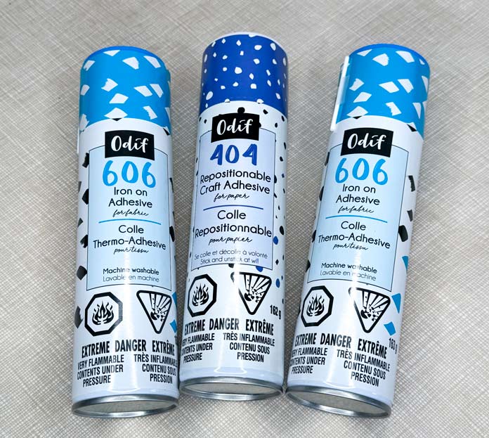 2 cans of Odif 606 Spray no-sew Fusible Adhesive Web and one can of Odif 404 spray and fix permanent repositionable adhesive.