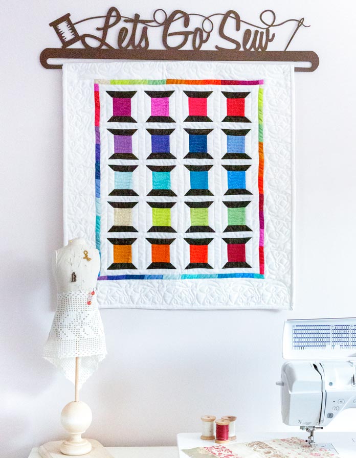 The Spotted Spools Quilted Banner pattern by Clodagh Coker of The Quilt Store for Issue 52; photo by Carla A. Canonico for ANPTmag