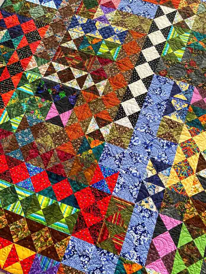 Borderlines! A Scrappy Hourglass Quilt by Elaine Theriault for ANPTmag Issue 69; photo by Carla A. Canonico for ANPTmag