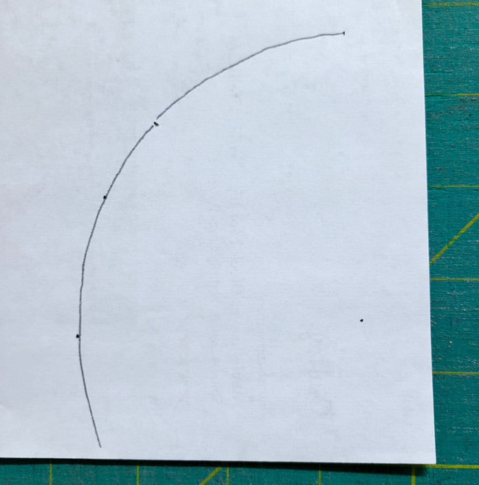 A pencil arc on white paper