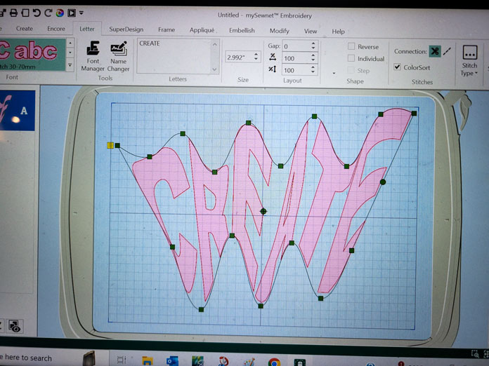 The word ‘create’ in curvy forms in pink on a computer screen; Husqvarna Viking Designer EPIC 2, Husqvarna Viking Adjustable Stitch in the Ditch Foot for IDF system, Inspira Tear-A-Way Stabilizer, Husqvarna Viking Multi-Function Foot Control, Husqvarna Viking Designer Royal Hoop; mySewnet embroidery software