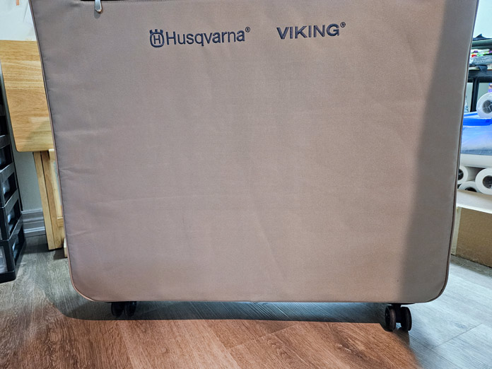 A large grey box on wheels; Husqvarna VIKING DESIGNER EPIC 3 and embroidery unit