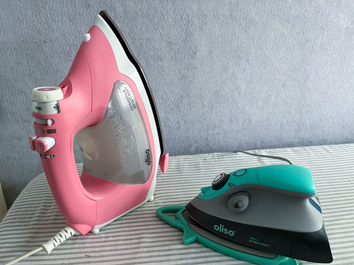 Pink Oliso Pro TG1600 Pro Plus Smart Iron and turquoise Oliso M2Pro Mini Project Iron with Solemate