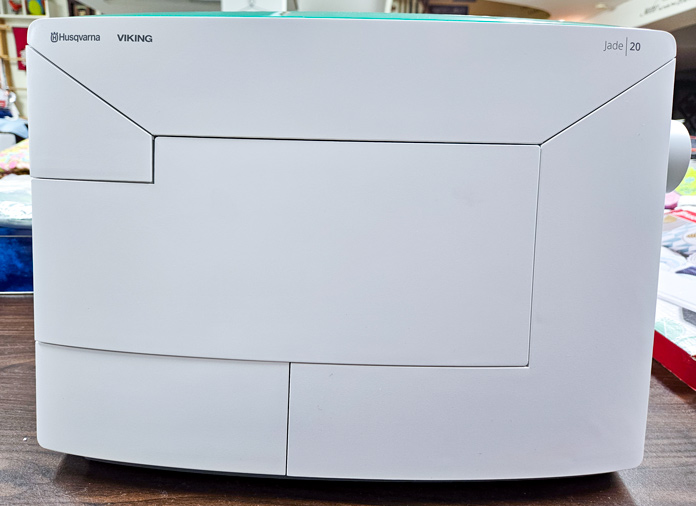 A sewing machine with a hard white case; Husqvarna VIKING Jade 20, sewing machine review, unboxing sewing machine, Jade 20 features, beginner sewing machine