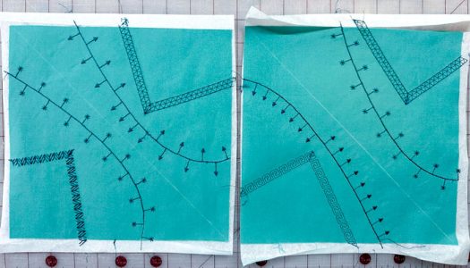 Two, 10” green fabric squares stitched in a darker green embroidery thread, showing the white stabilizer still underneath the fabric. A white chalk line divides the square into 2 triangles. A tapered 45° decorative stitch forms in each triangle corner and a curvy, funky line, showing a bold, straight stitch with Radiating Specialty Stitches at 90° going off the central connecting line.