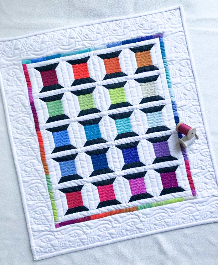 The Spotted Spools Quilted Banner pattern by Clodagh Coker of The Quilt Store for Issue 52; photo by Carla A. Canonico for ANPTmag