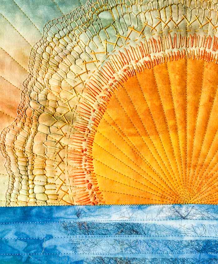 Close-up of the hand and sewing machine stitching of Dawn of a New Day Art Quilt by Ana Buzzalino for ANPTmag Issue 71; photo by Ana Buzzalino for ANPTmag