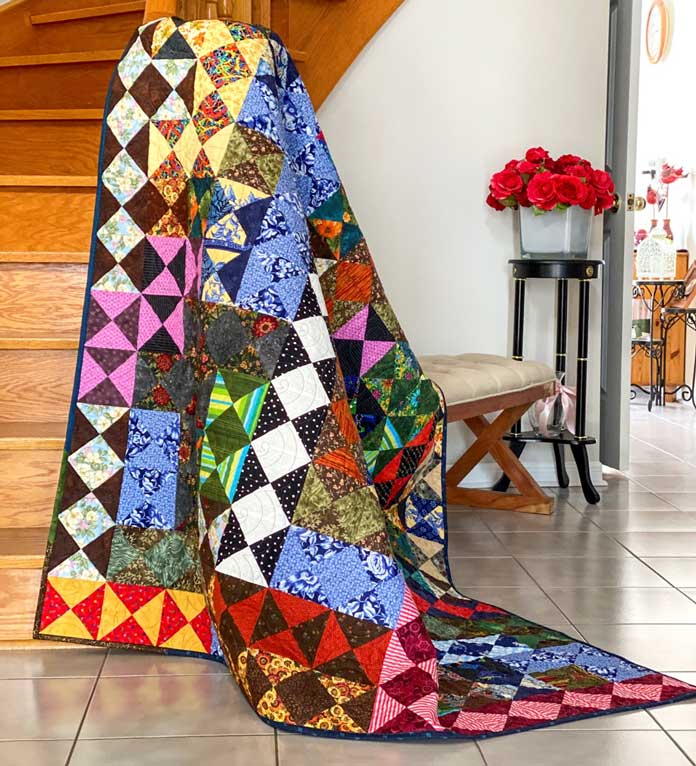 Borderlines! A Scrappy Hourglass Quilt by Elaine Theriault for ANPTmag Issue 69; photo by Carla A. Canonico for ANPTmag