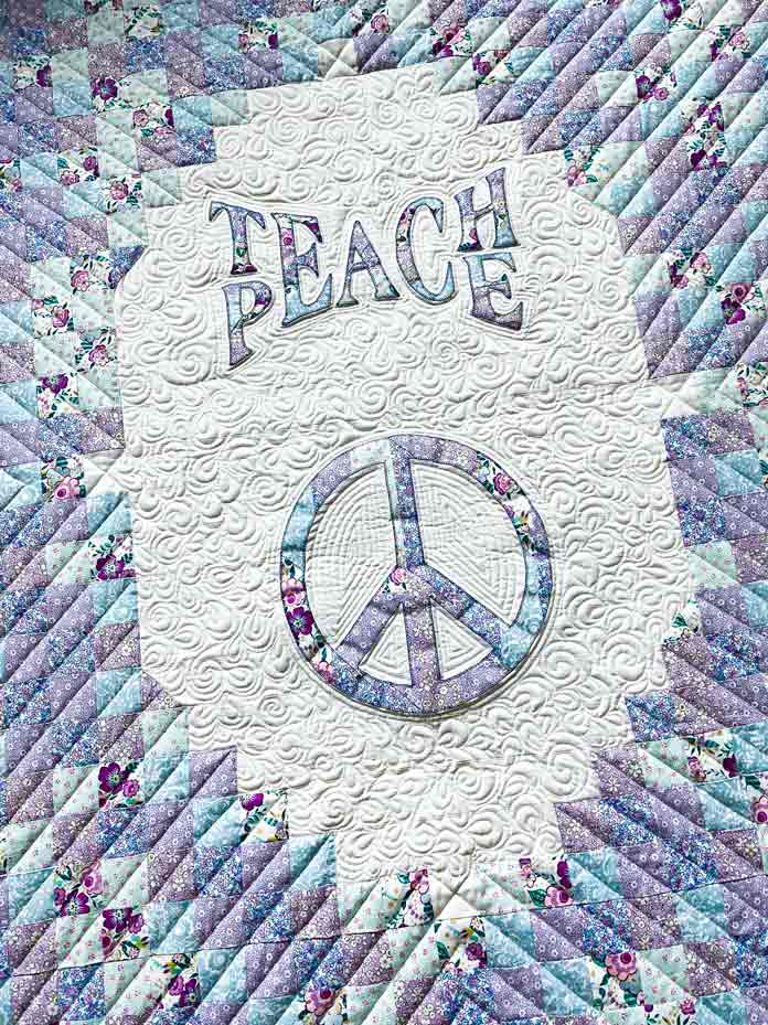 Check out the intricate quilting in Clodagh Coker’s Teach Peace Flower Power Quilt featured in ANPTmag Issue 57; photo by Carla A. Canonico for ANPTmag