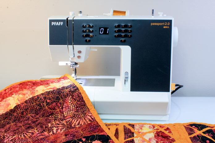 Finishing the binding on a placemat on the PFAFF passport 2.0 sewing machine