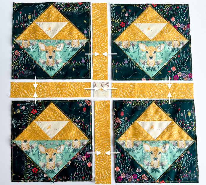 Pre-cut pieces for cushion top with four trimmed blocks and sashing strips with marks of assembly steps
