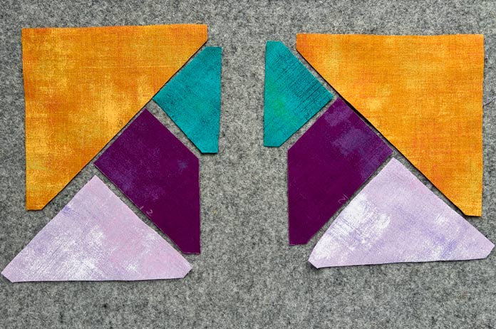 Pre-cut pieces for two blocks with marks on the wool pressing mat 