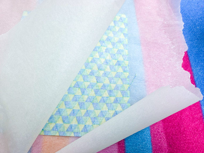 Fabric between two layers of parchment paper