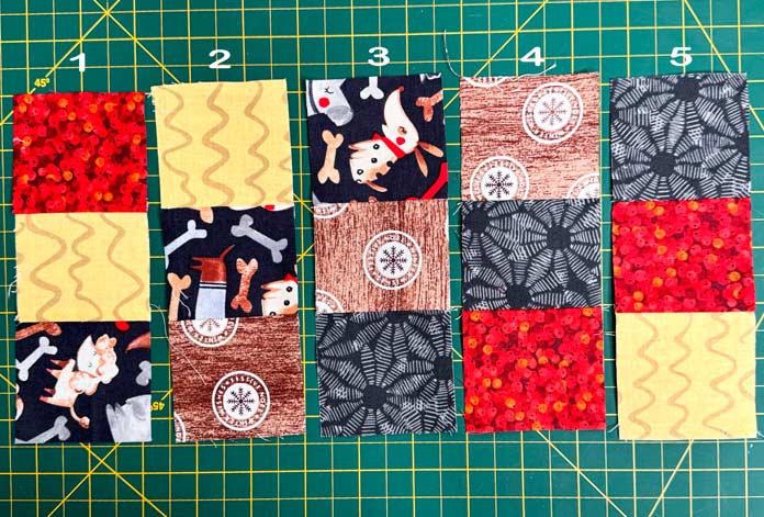 Five sets of three fabrics each are made using 2½” x 2½” squares.
