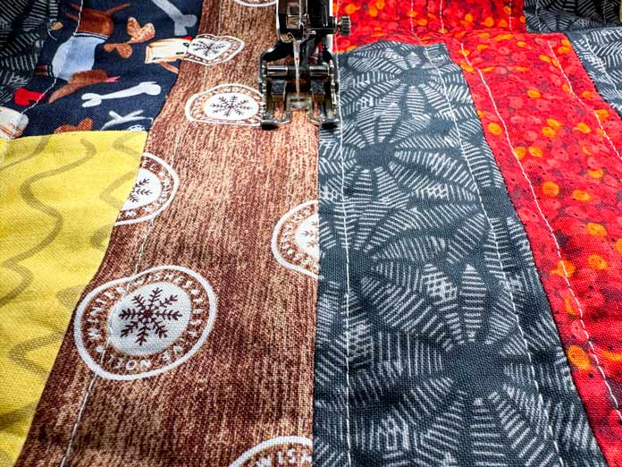 Quilting parallel lines in the center of the quilt.