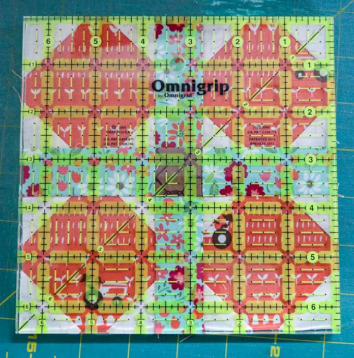 A quilt block with a 6½” ruler on it