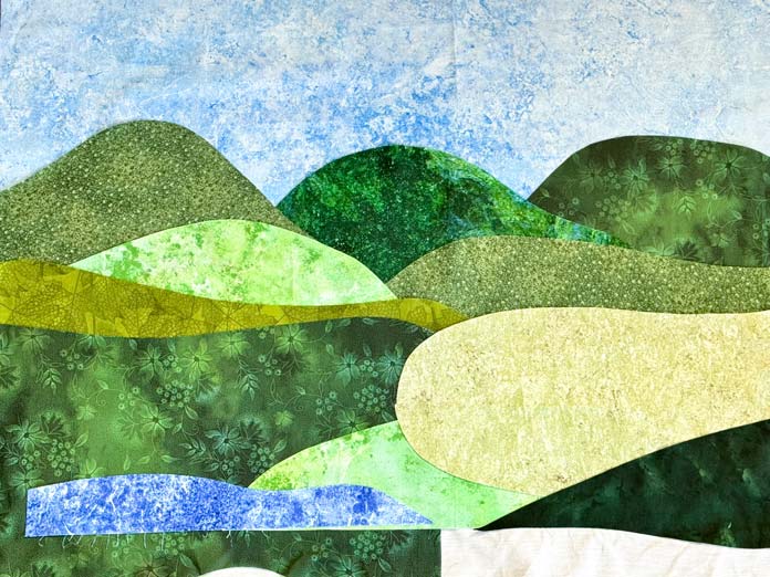 Multiple pieces of fabric are secured to the HeatnBond interfacing with the help of the Oliso Pro iron.