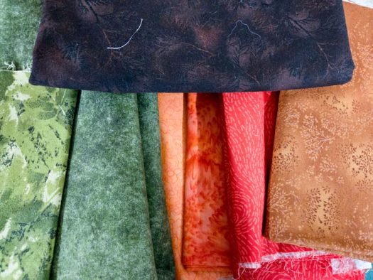 Orange, green, and brown fabrics