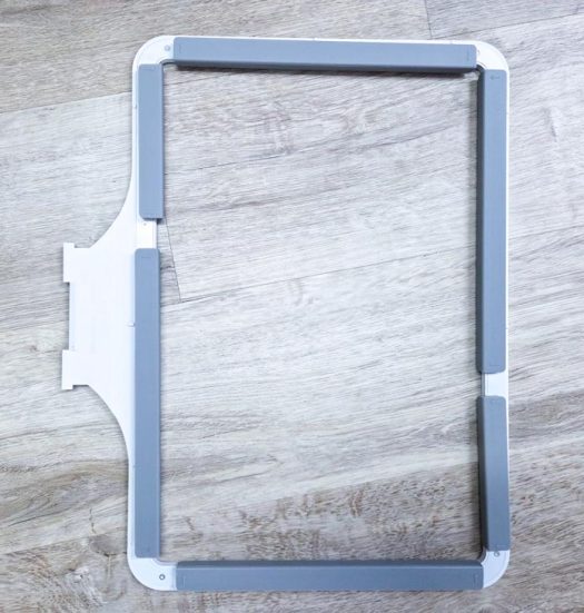 A grey machine embroidery hoop