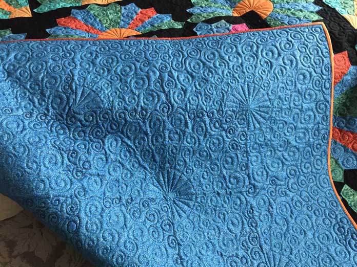 The back of the Sunburst Quilt pattern by Elaine Theriault for Issue 47; photo by Carla A. Canonico for ANPTmag