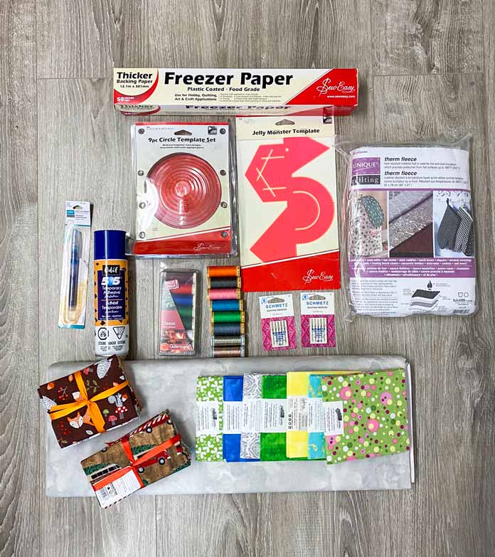 Supplies to make free motion quilting practice samples; Fabric Creations, Fabric Palette, Gütermann Sew-All Thread, UNIQUE Quilting Therm Fleece, Sew Easy, Sew Easy Freezer Paper, Sew Easy Jelly Monster Template, Odif 505 Temporary Quilt Basting Adhesive Fabric Spray, SCHMETZ Quilting Needles, UNIQUE Sewing Wash-Out Marker, Sew Easy 9 Piece Circle Template