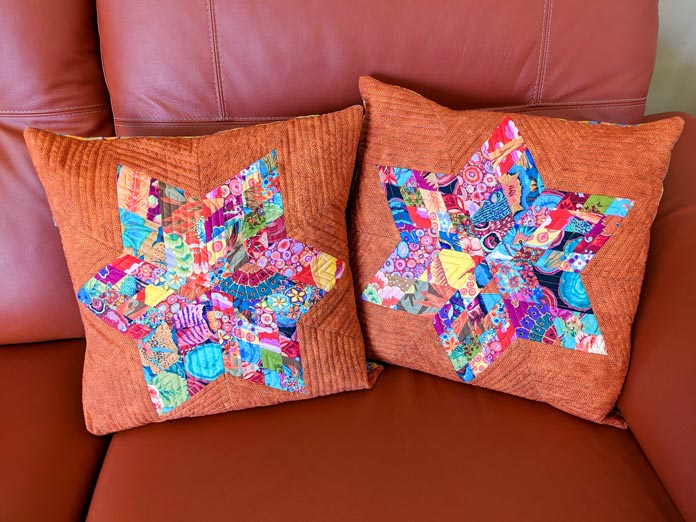 Two quilted 6-point star pillows 