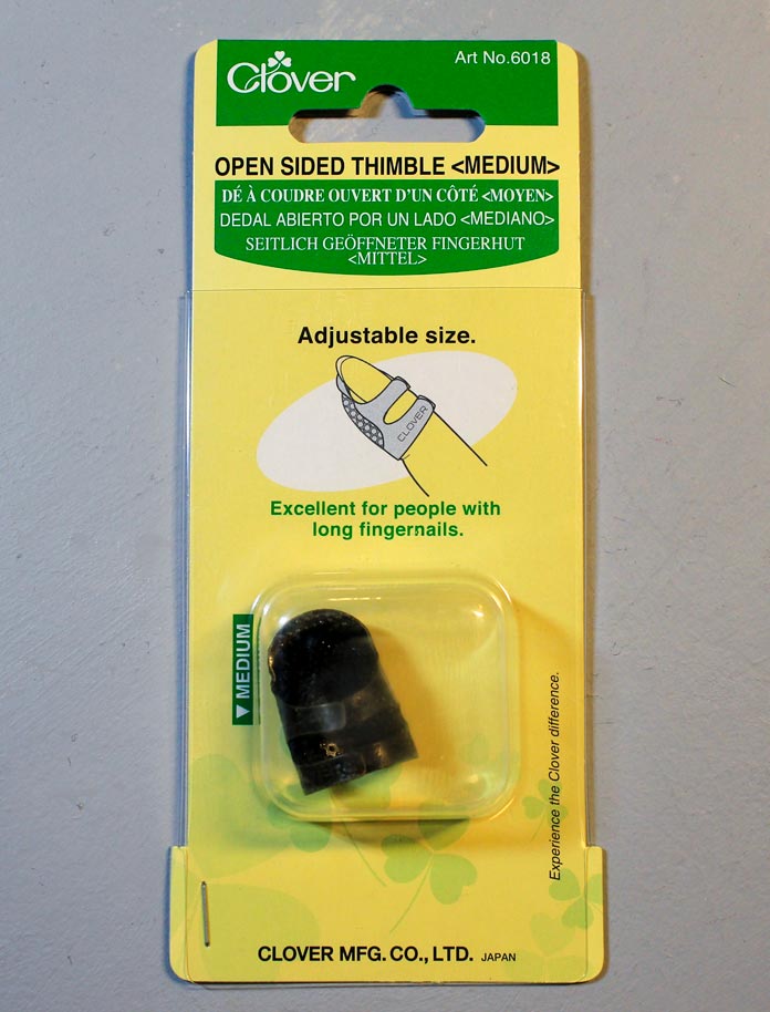 Medium sized Clover Open-Sided Thimble in its package 