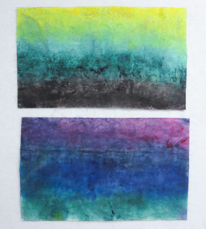 2 pieces of fabric painted with stripes of Rit liquid dyes