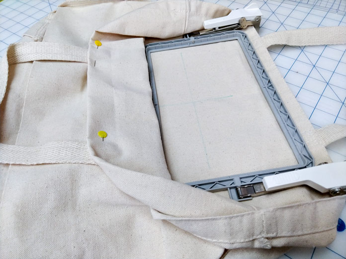 A tote bag snapped into the Brother border frame, ready to embroider. Brother Luminaire XP
