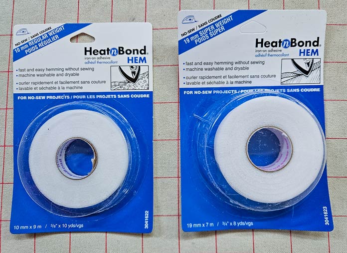 Two blue and white packages; HeatnBond Hem products