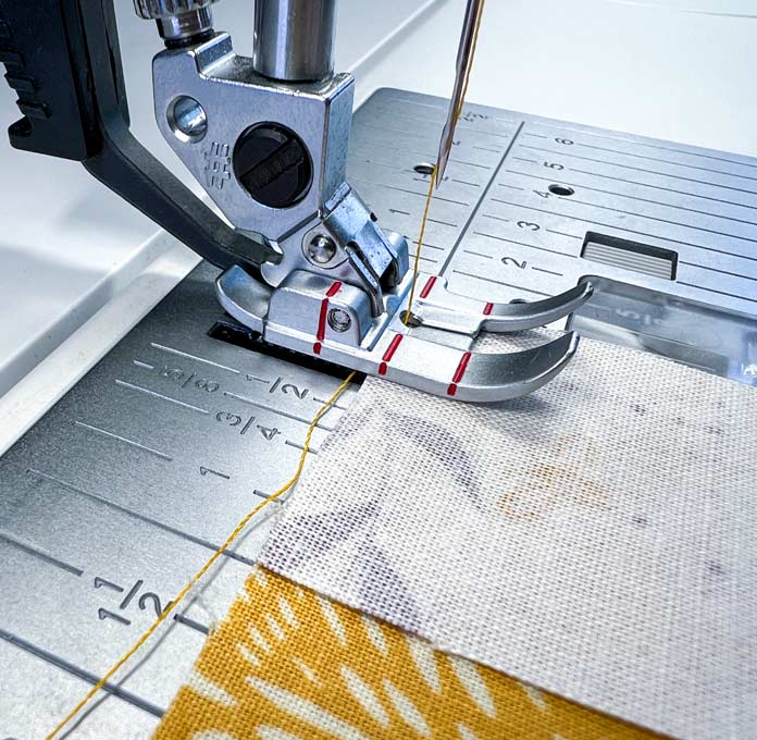 Close-up of pieces stitching with a PFAFF ¼” Quilting Foot for IDT System