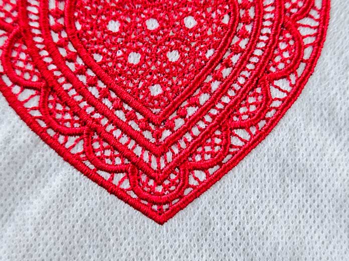 Red stitching on white fabric